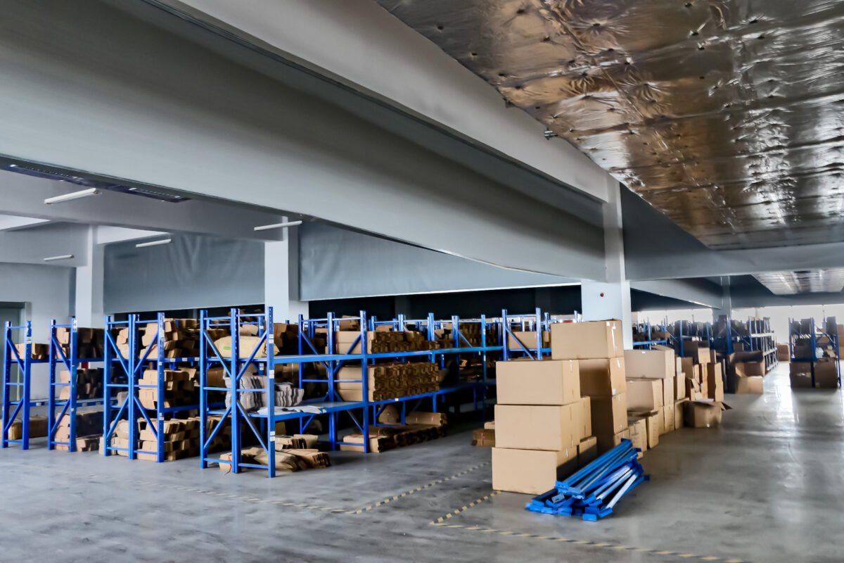Parts storage area with shelving and cartons